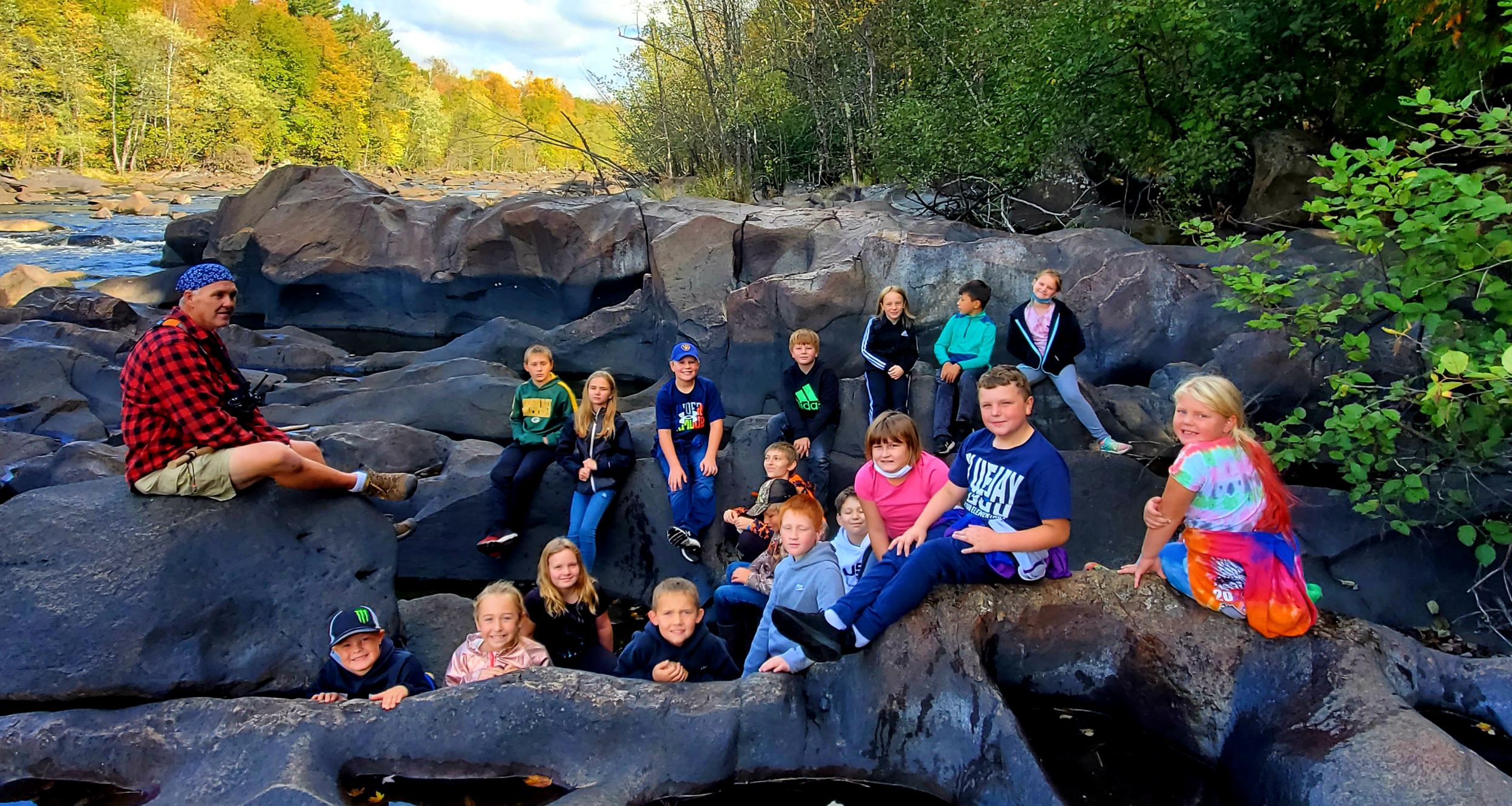 Students on rocks at School Forest